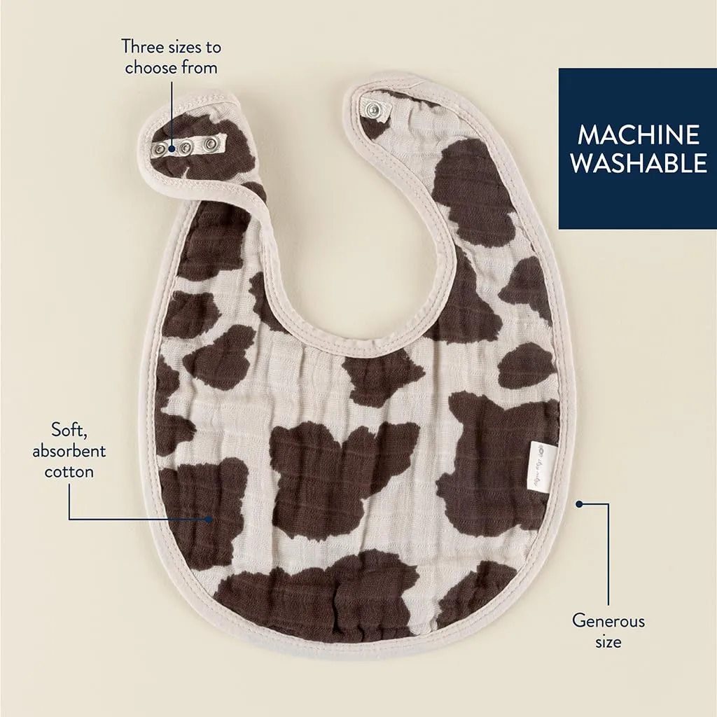 Itzy Ritzy Set of 3 Baby Bibs - Ultra-Soft Adjustable Infant & Toddler Bibs Made of Triple-Layer Cotton Muslin, Ideal for Drooling, Teething, & Eating - 3 Stylish, Coordinating Prints (Cow Print)